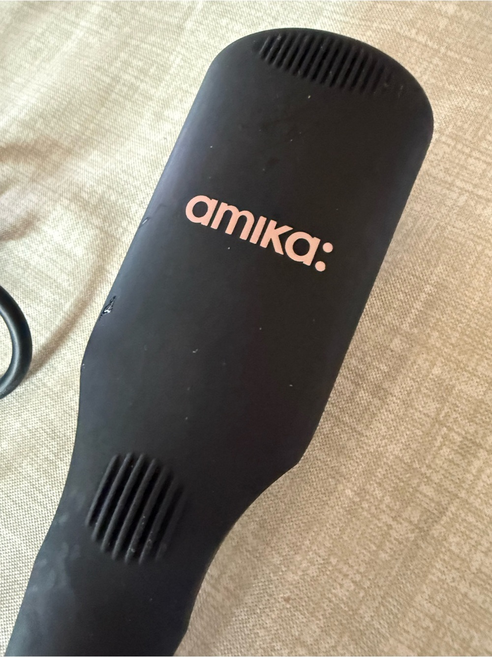 amika Straightening Brush and hair polisher.